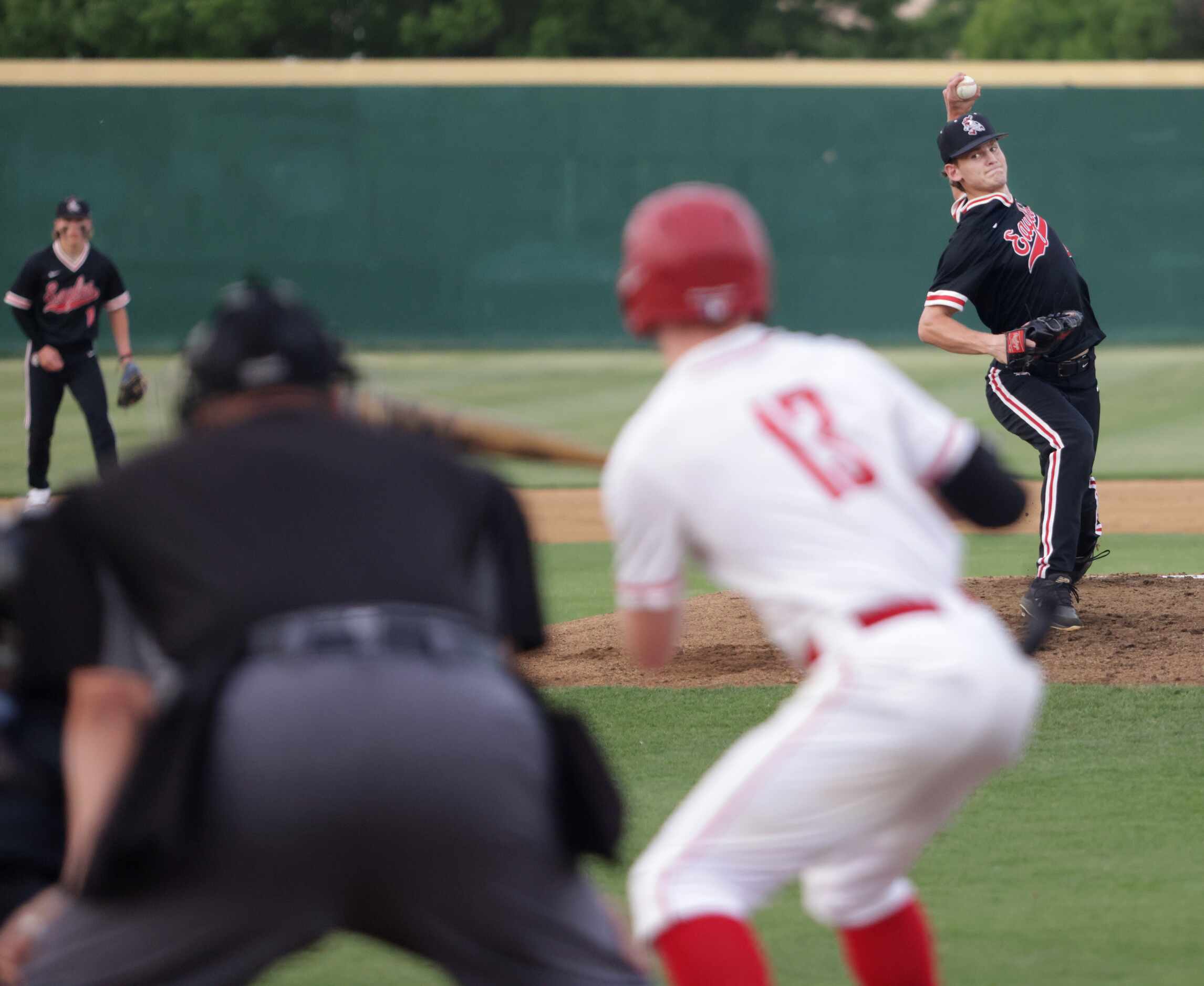 Argyle High School player Alex D'Angelo pitches against Grapevine High School player Peyton...