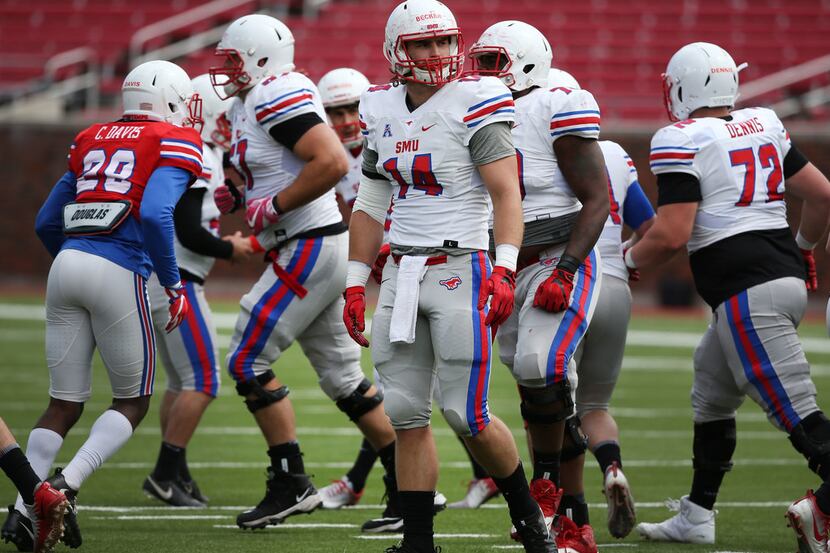 Southern Methodist Mustangs tight end Ryan Becker (14) walks onto the field during Southern...