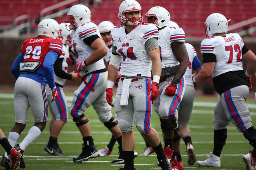 Southern Methodist Mustangs tight end Ryan Becker (14) walks onto the field during Southern...