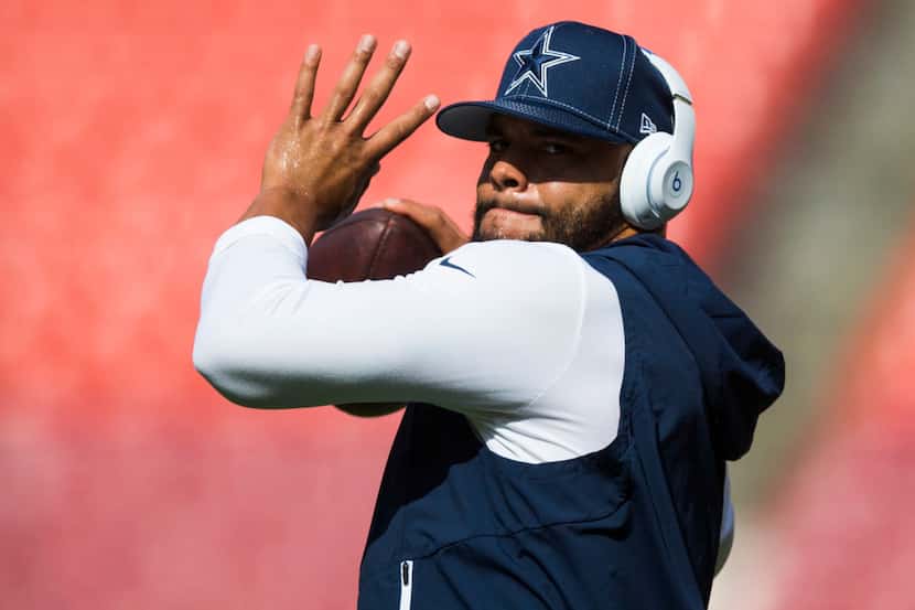 Dallas Cowboys quarterback Dak Prescott (4) warms up before an NFL game between the Dallas...