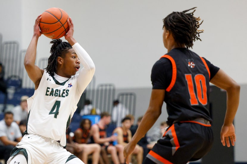 Mansfield Lake Ridge's Amir McMillian (4) looks to pass the ball away from Rockwall's Lathan...