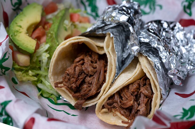 A Brisket Taco Combo severed with lettuce, tomato and avocado from Taco Joint in Dallas, on...