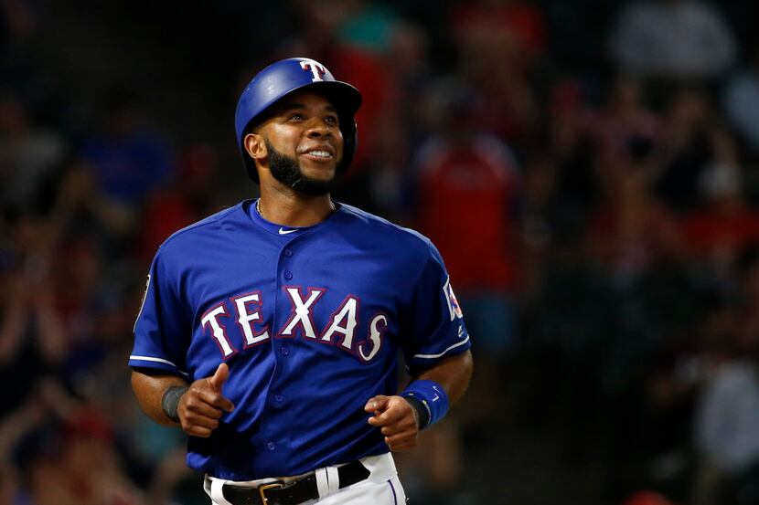 FILE — Texas Rangers shortstop Elvis Andrus smiles after scoring a run on the double by...