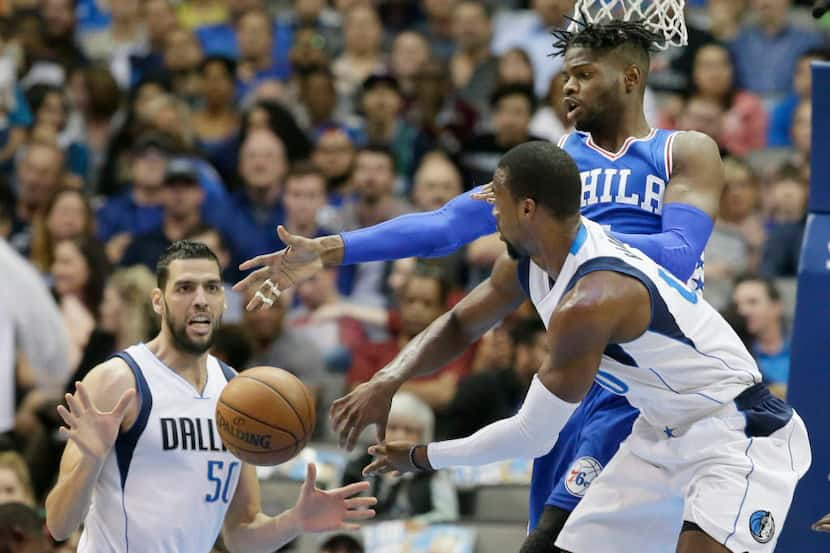 Dallas Mavericks forward Harrison Barnes (40) passes to center Salah Mejri (50) against...