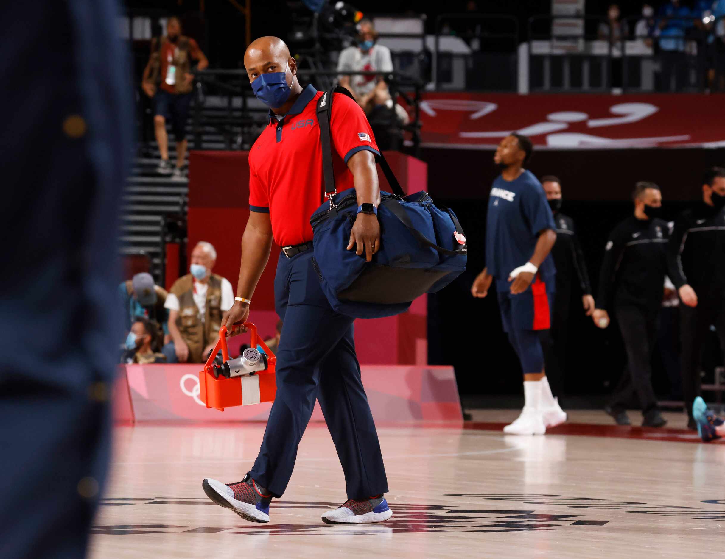 USA’s head athletic trainer Dionne Calhoun makes his way to the bench before the gold medal...