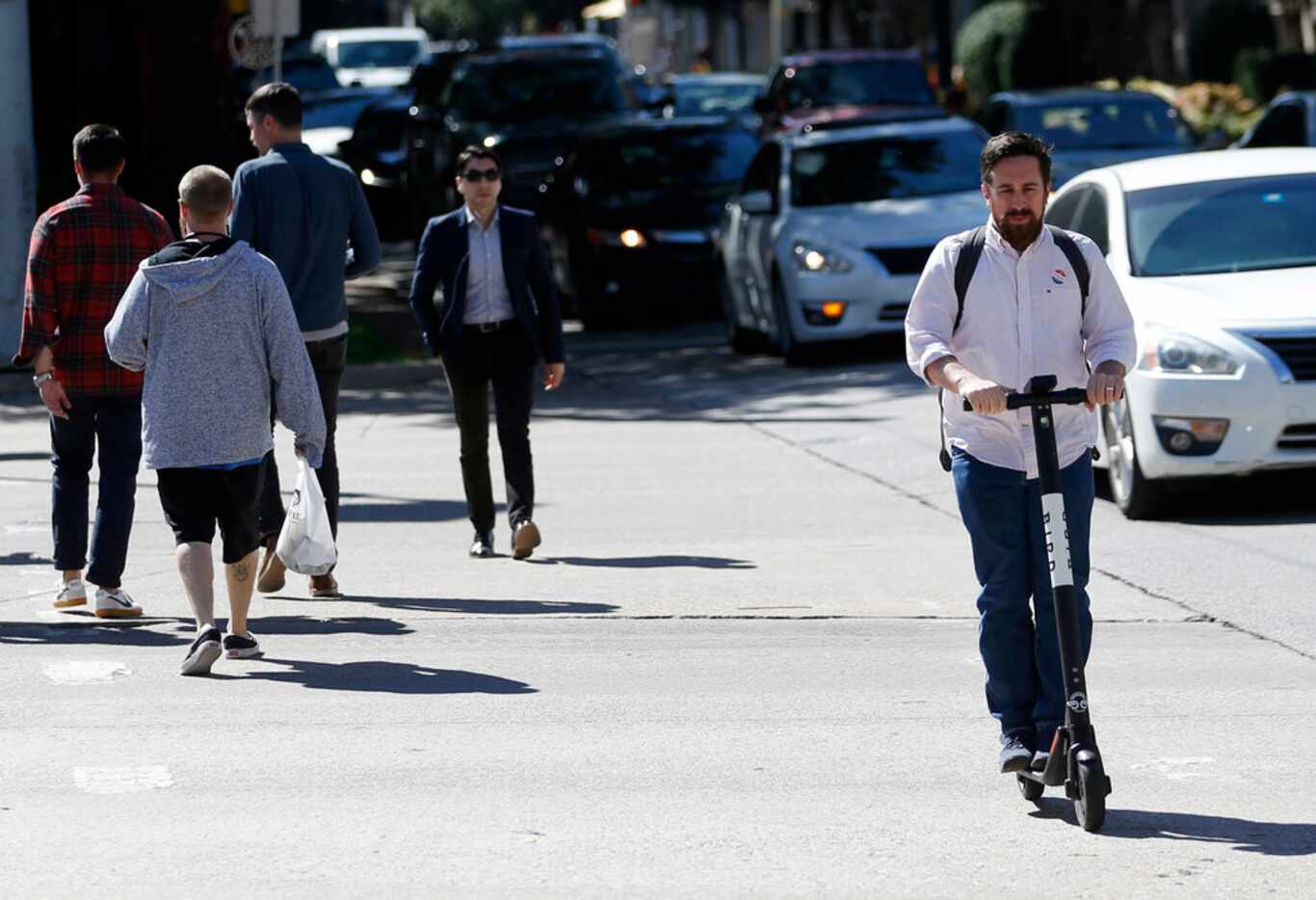 A man rides a Bird electric scooter in Uptown in Dallas, on Tuesday, October 23, 2018....