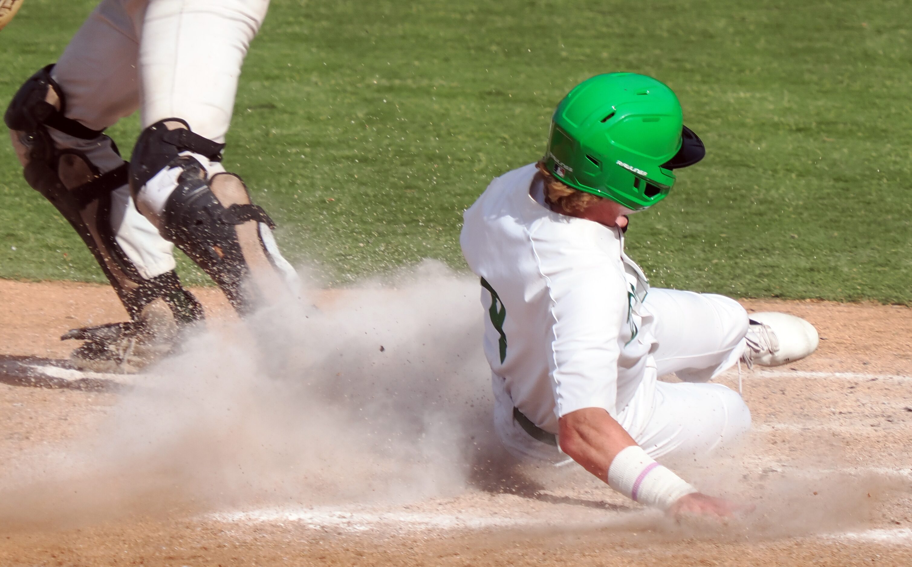 Southlake Carroll baserunner Tyson Drake (4) scores a run against San Antonio Reagan in the...