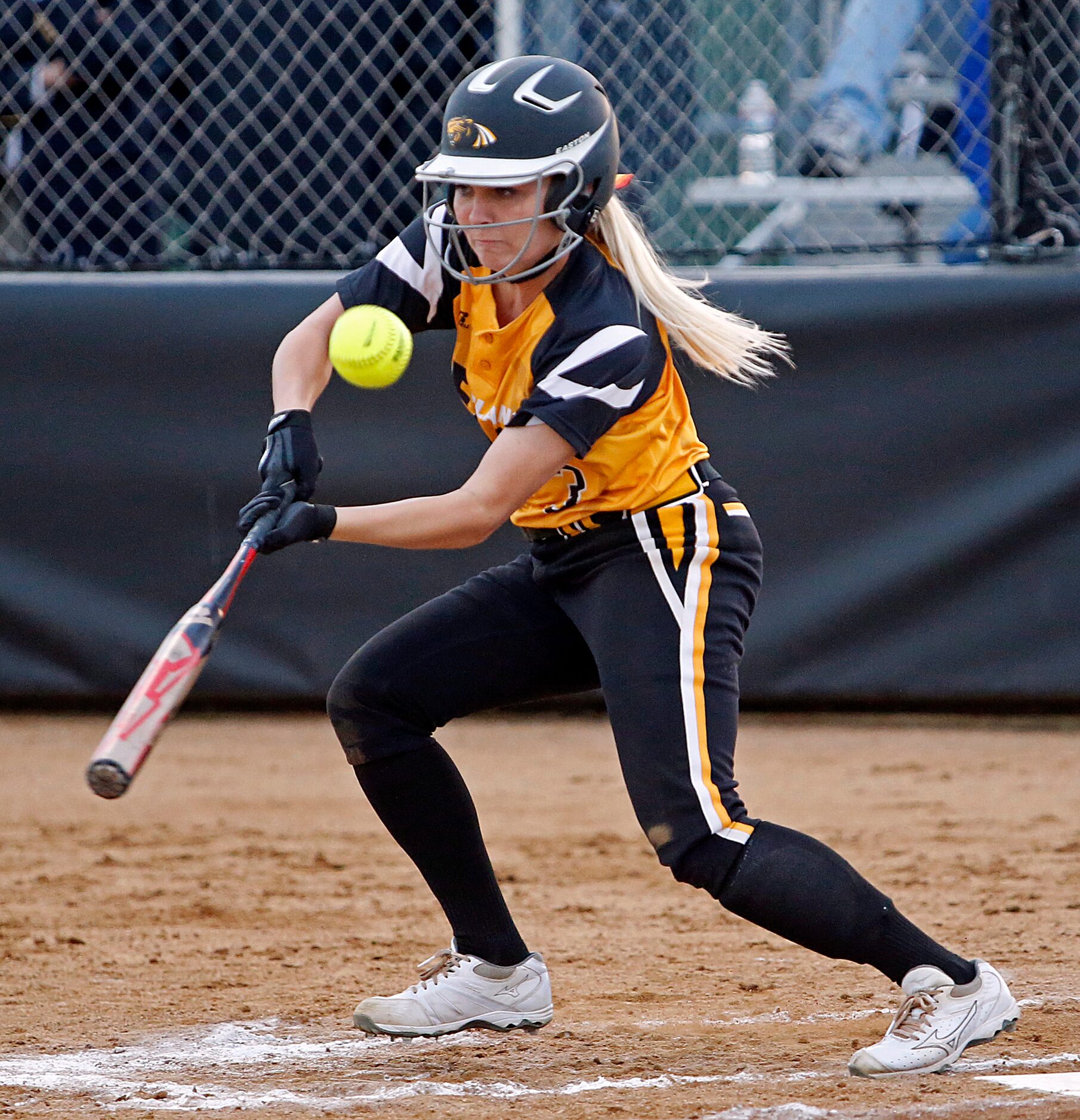 Plano East High School outfielder Haley Wisdom (3) makes contact but was unable to get on...