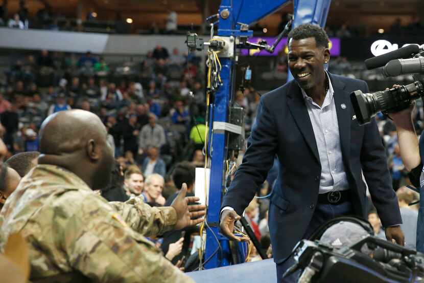 Dallas Mavericks Michael Finley greets soldiers before the start of the Seat for Soldiers...