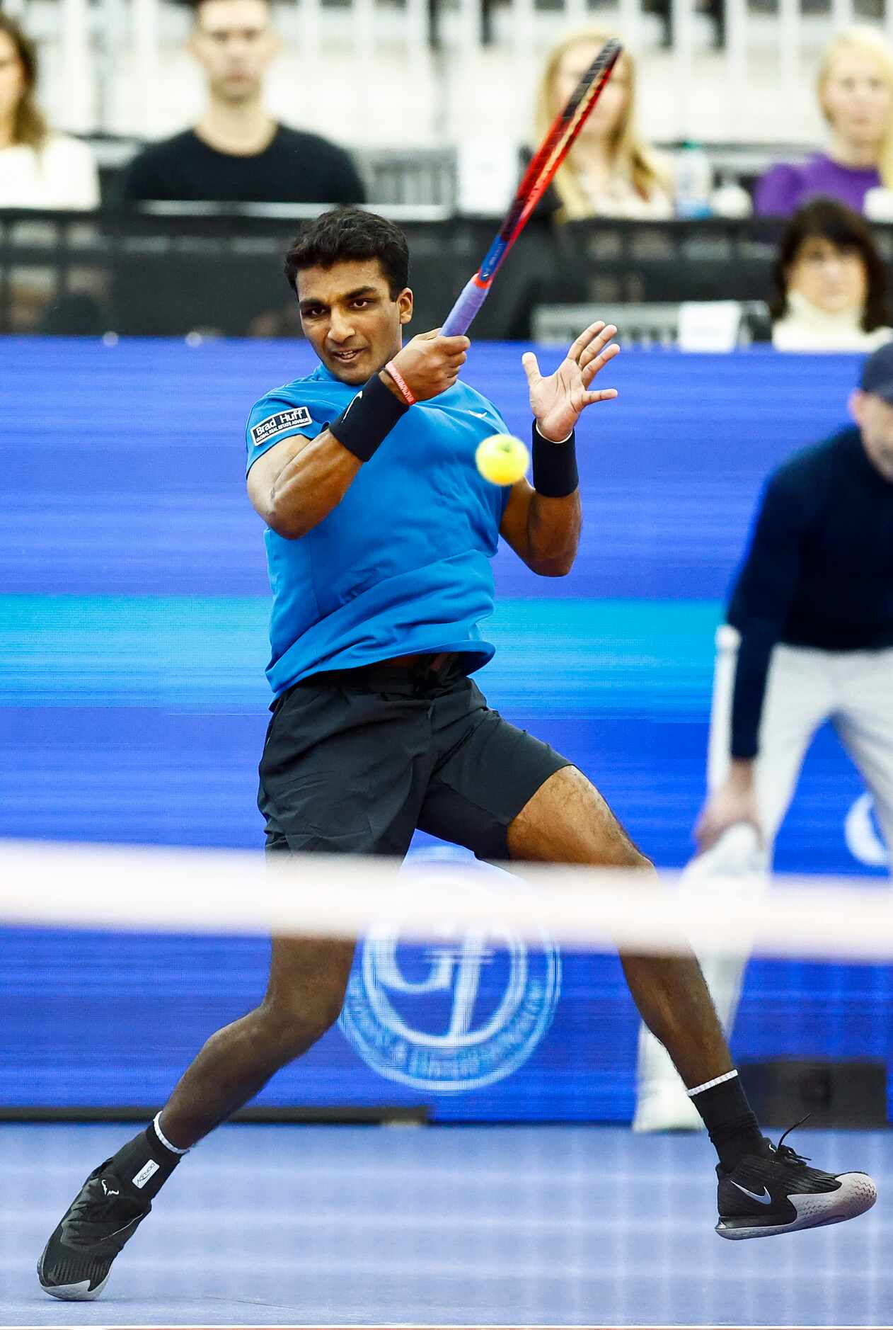 SMU senior Caleb Chakravarthi returns the ball in a match against Vasek Pospisil during the...