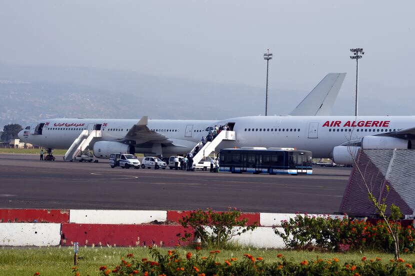 Passengers boarded an Air Algerie plane at the Houari-Boumediene International Airport in...