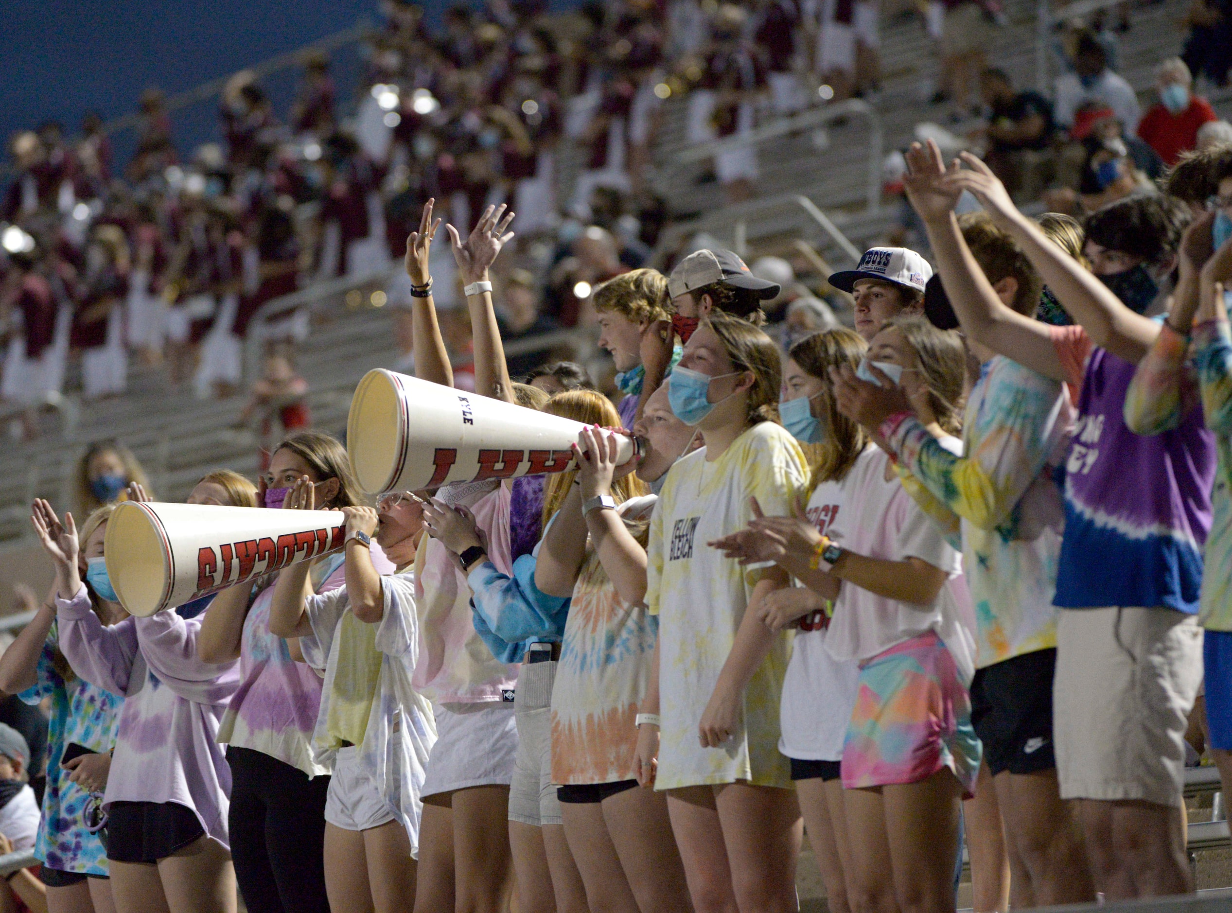 Lake Highland students celebrate after a touchdown in the first quarter of a high school...