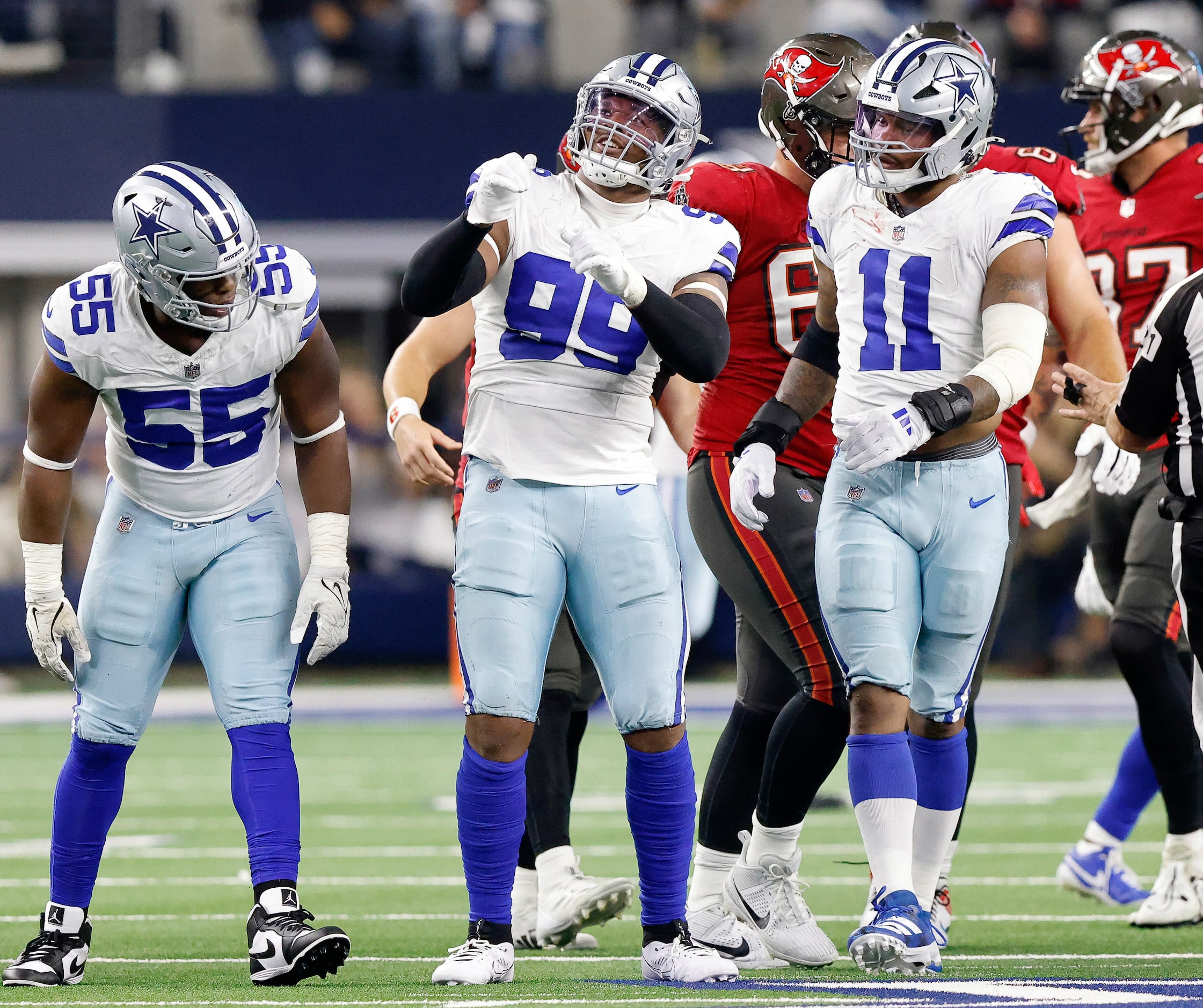 Dallas Cowboys defensive end Chauncey Golston (99) celebrates his sack of Tampa Bay...