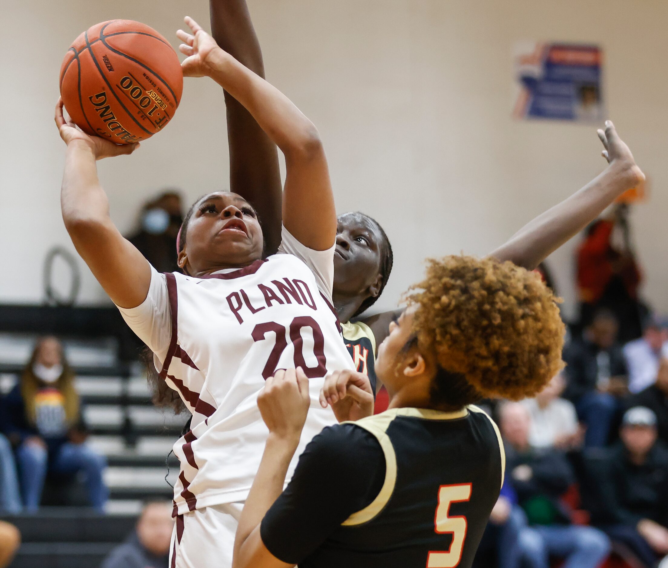 Plano Senior High School Danielle Bennett (20) shoots the ball while defended by South Grand...