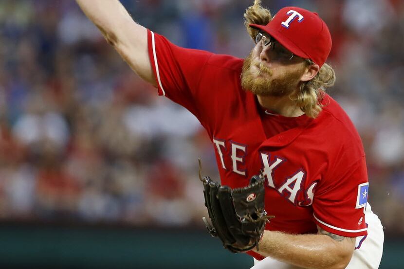 Texas Rangers starting pitcher A.J. Griffin (64) throws a pitch against Boston Red Sox...