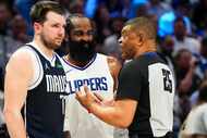 Dallas Mavericks guard Luka Doncic (77) and LA Clippers guard James Harden (1) talk with...