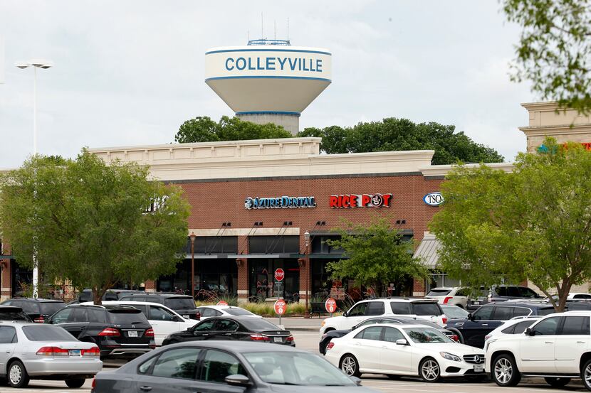 A Colleyville water tower is pictured near a shopping center in Colleyville in this file photo.