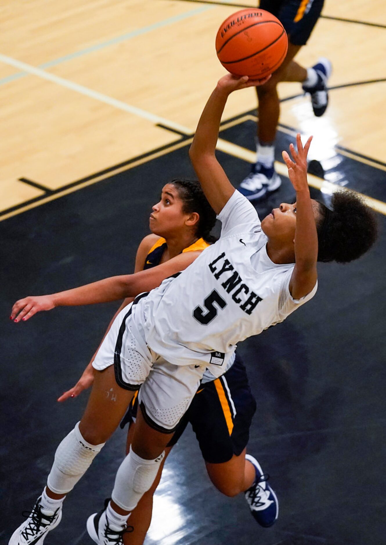 Bishop Lynch guard Maddie Cockrell (5) puts up a shot past Prestonwood Christian guard...