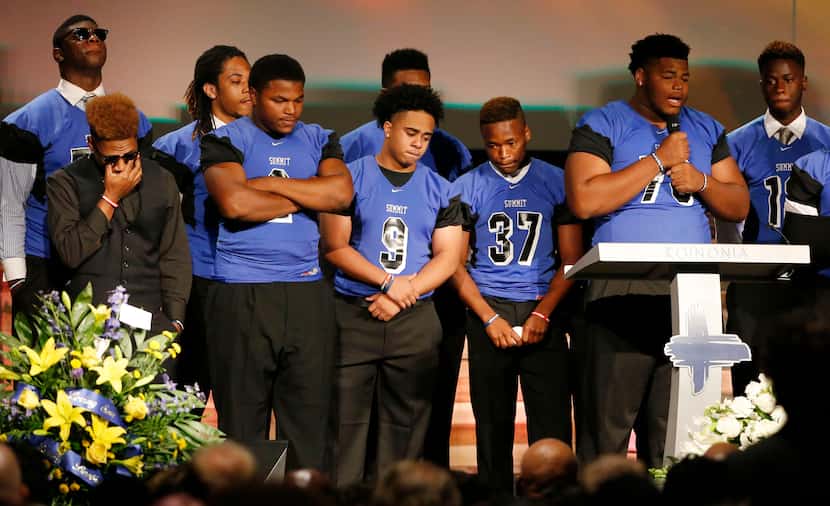  Members of the Mansfield Summit High School football team speak during the funeral service...