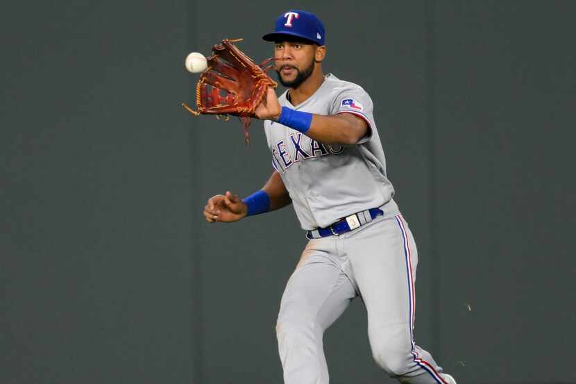 Texas Rangers center fielder Leody Taveras catches a fly ball off the bat of the Kansas City...