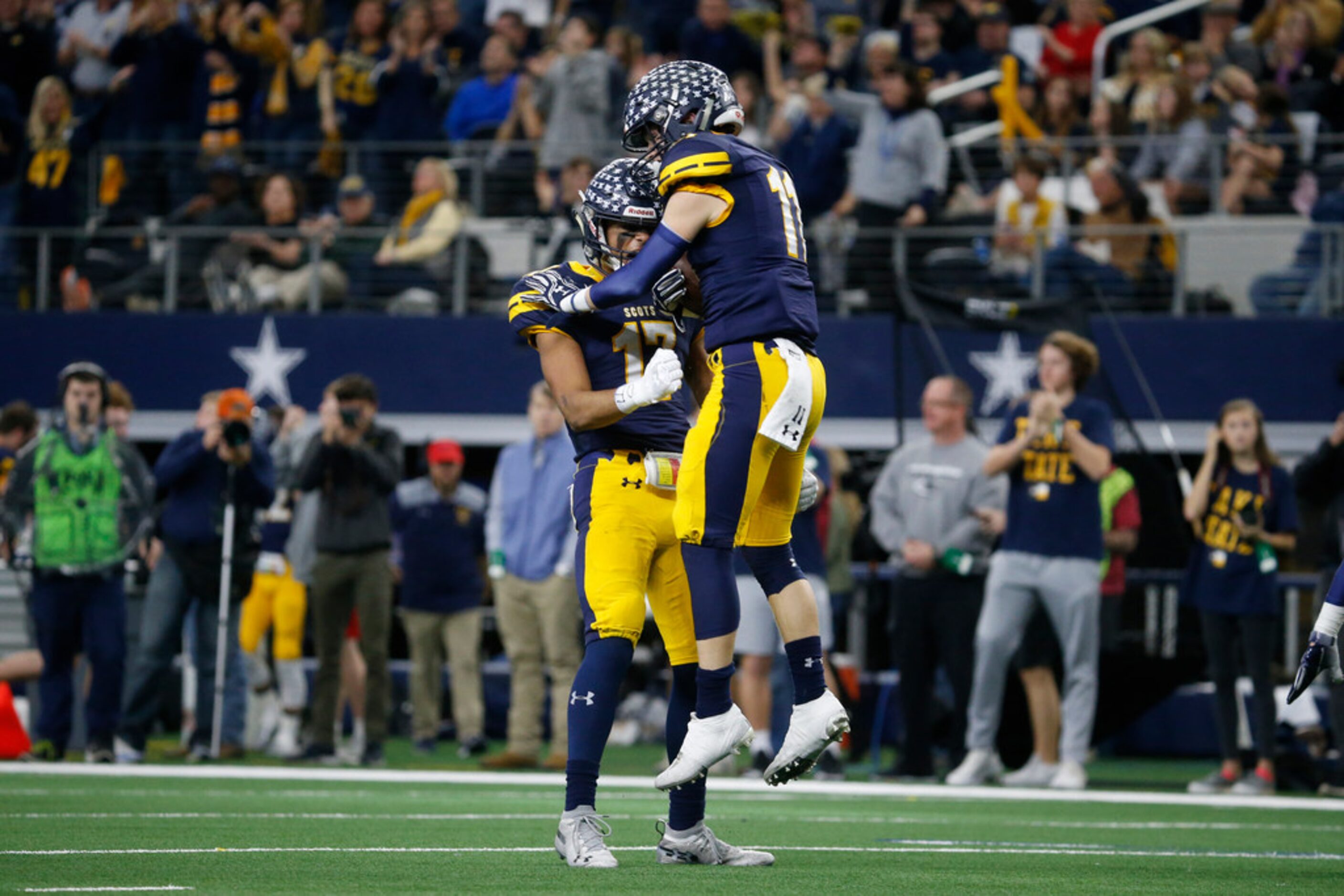 Highland Park's Whit Winfield (11) and Ryan Khetan (17) celebrates Winfield's interception...