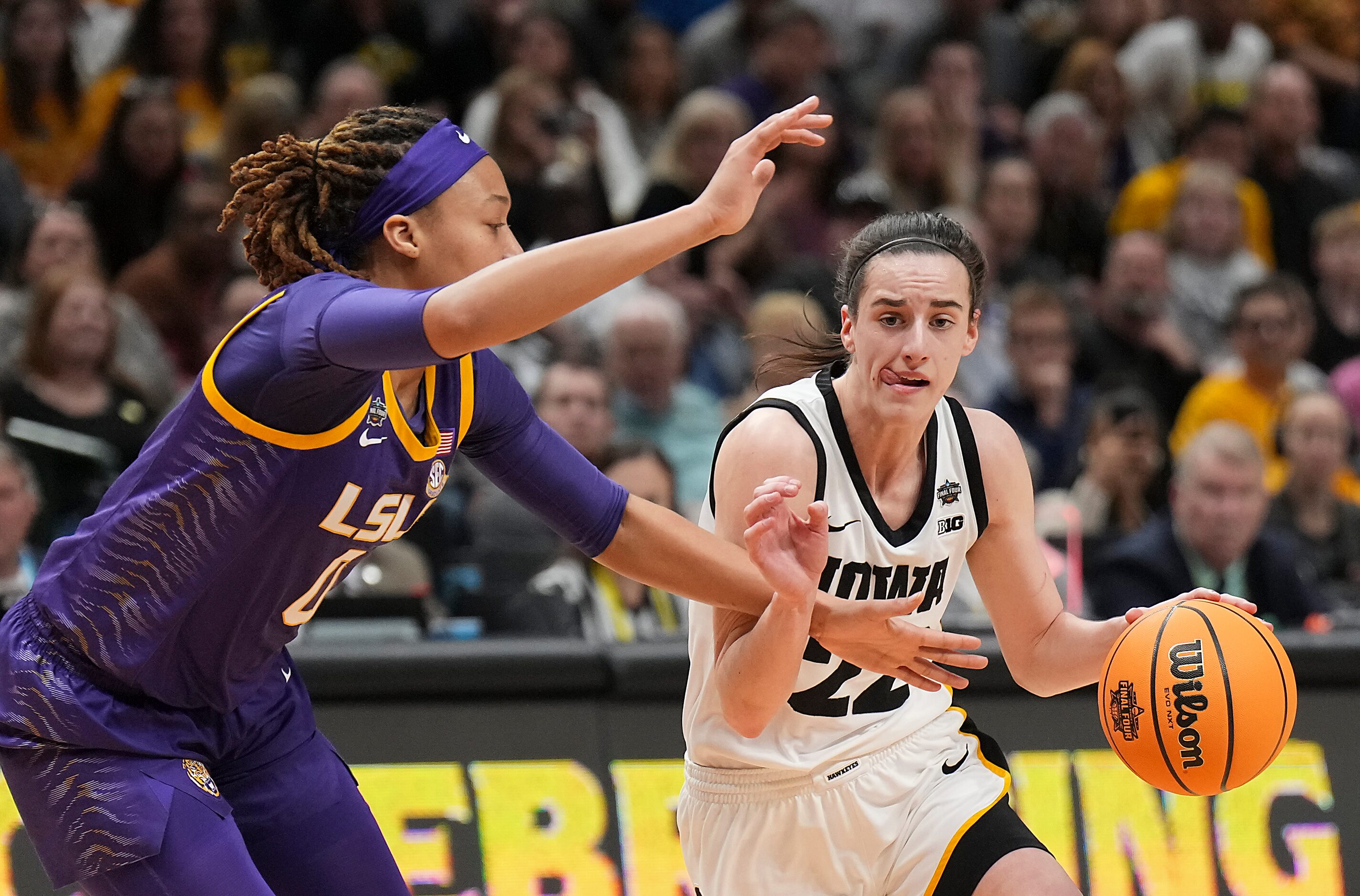 LSU forward LaDazhia Williams (0) defends against Iowa guard Caitlin Clark (22) of the NCAA...