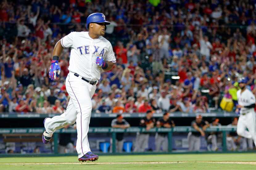 Texas Rangers Adrian Beltre (29) races to first on a single against the Baltimore Orioles in...