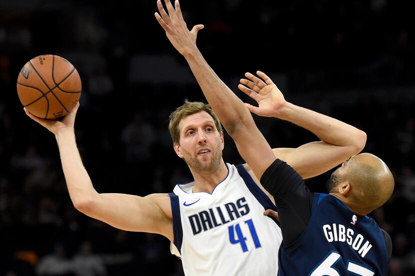 Dallas Mavericks forward Dirk Nowitzki (41), of Germany, passes against Minnesota...