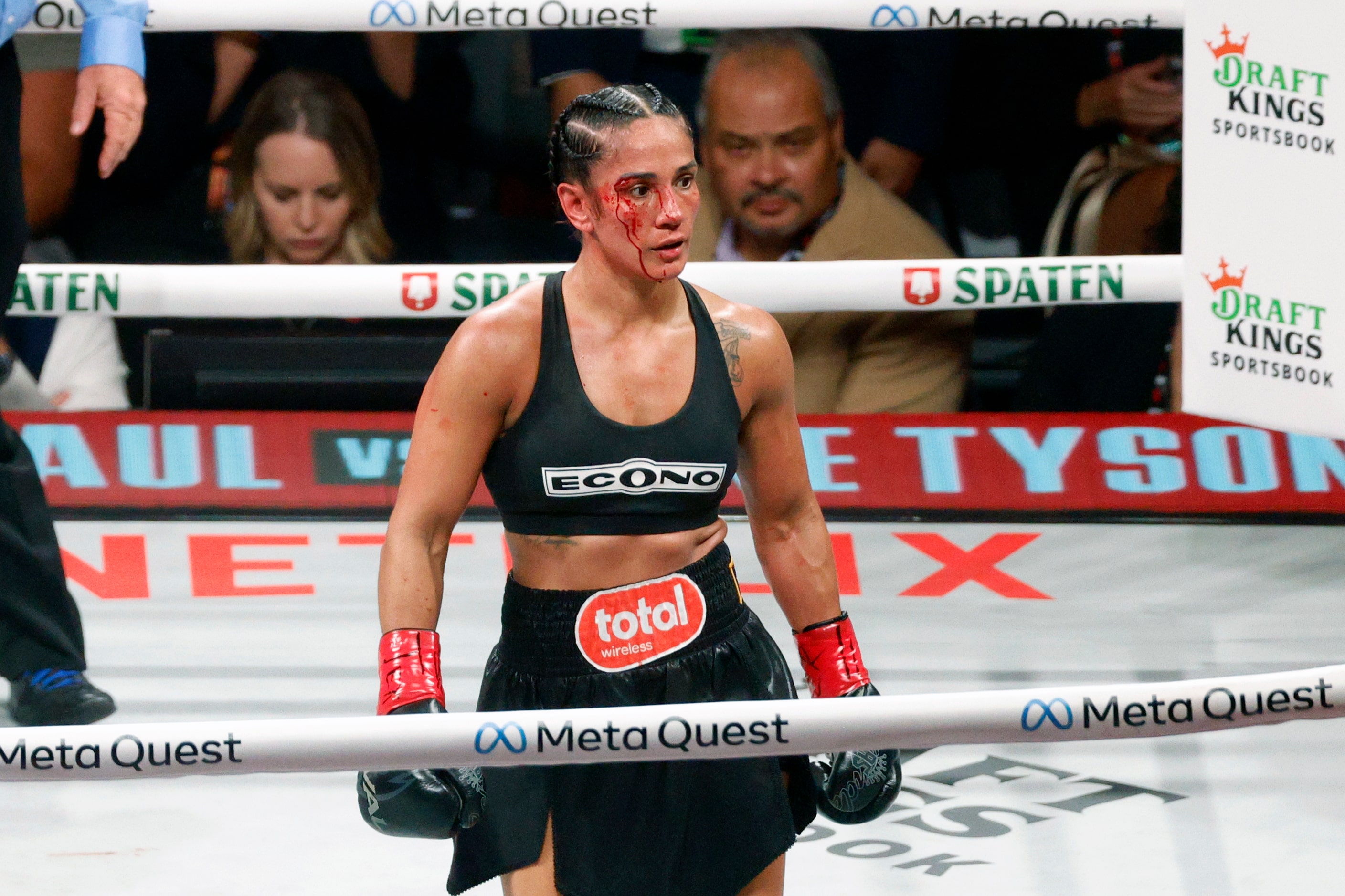 Amanda Serrano heads to her corner after round three of the undisputed super lightweight...