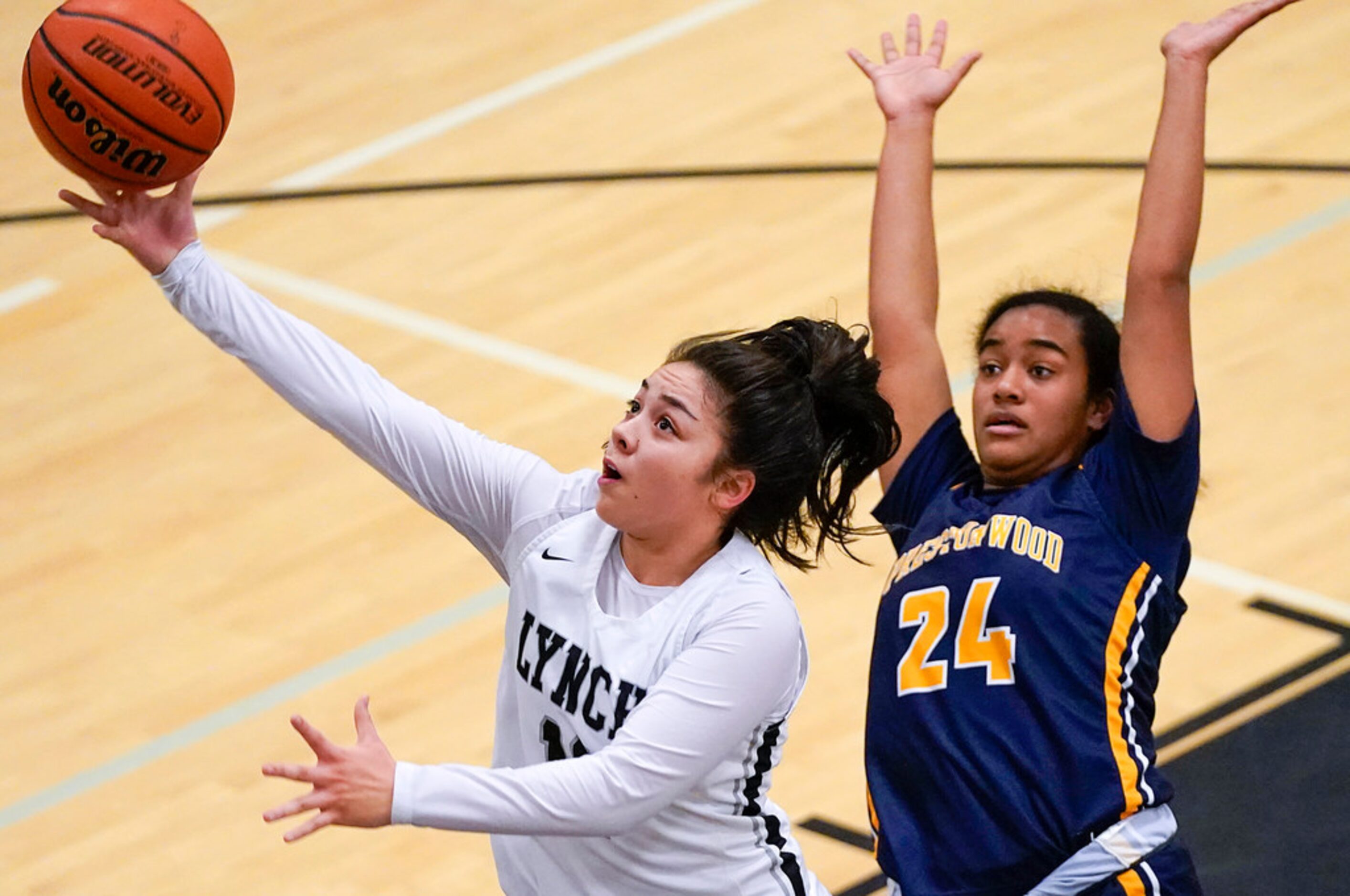 Bishop Lynch guard Talia DePetrillo (11) drives to the basket past Prestonwood Christian...