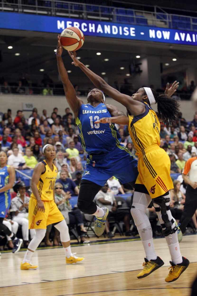 Dallas Wings guard Karima Christmas (13) makes a basket and is fouled by Indiana Fever...