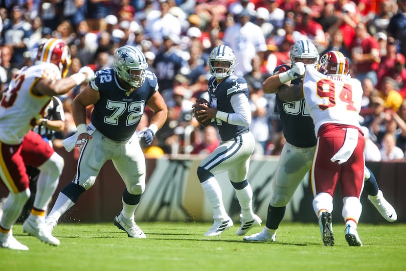 Dallas Cowboys quarterback Dak Prescott (4) looks to make a pass during the first half of an...