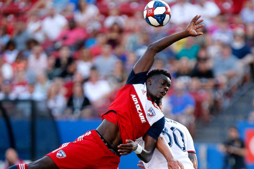 FC Dallas forward Dominique Badji, left, is unable to reach the ball over Real Salt Lake...