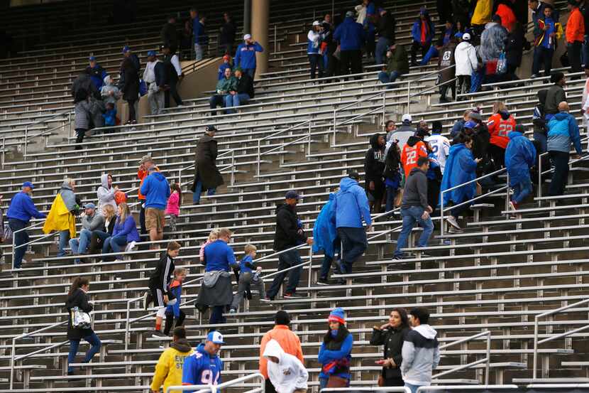 Fans at Dallas' Cotton Bowl hit the exits after the SERVPRO First Responder Bowl was...