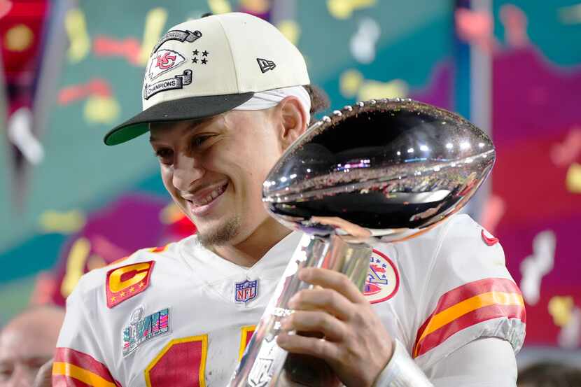 Kansas City Chiefs quarterback Patrick Mahomes (15) holds the trophy after their win against...