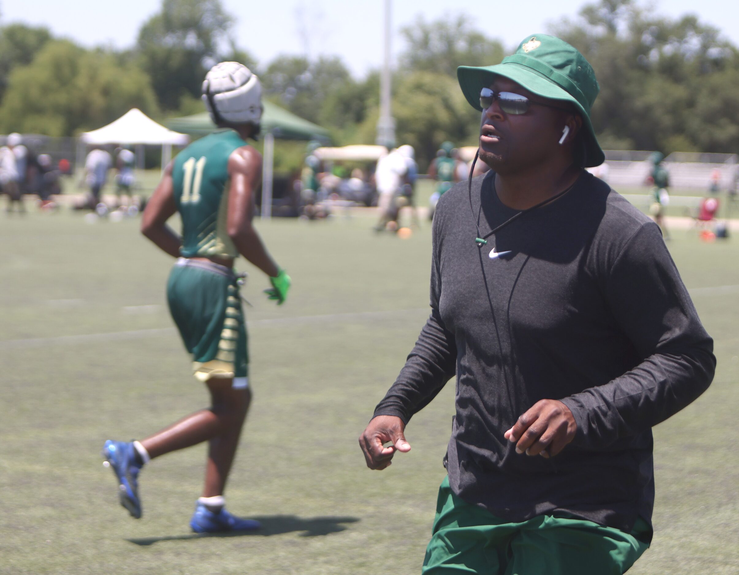 DeSoto head coach Claude Mathis races to the aid of his son Caimon Mathis (2), suffering...