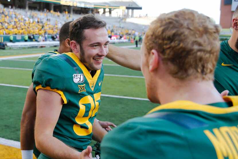 Baylor Bears place kicker John Mayers (95) is congratulated by Baylor Bears wide receiver...