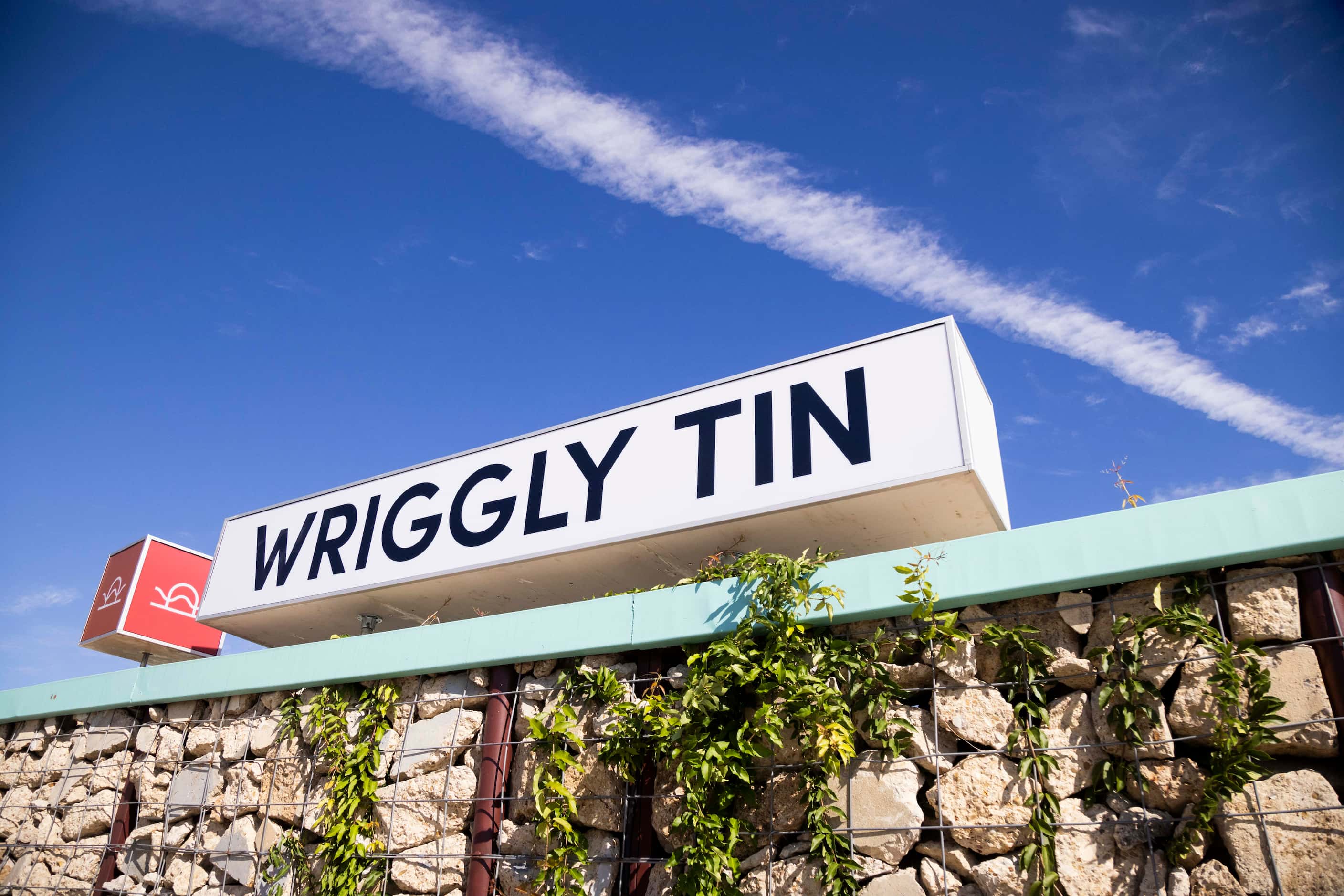 An exterior sign for the Wriggly Tin, a new bar near Fair Park, in Dallas on Monday, Oct....