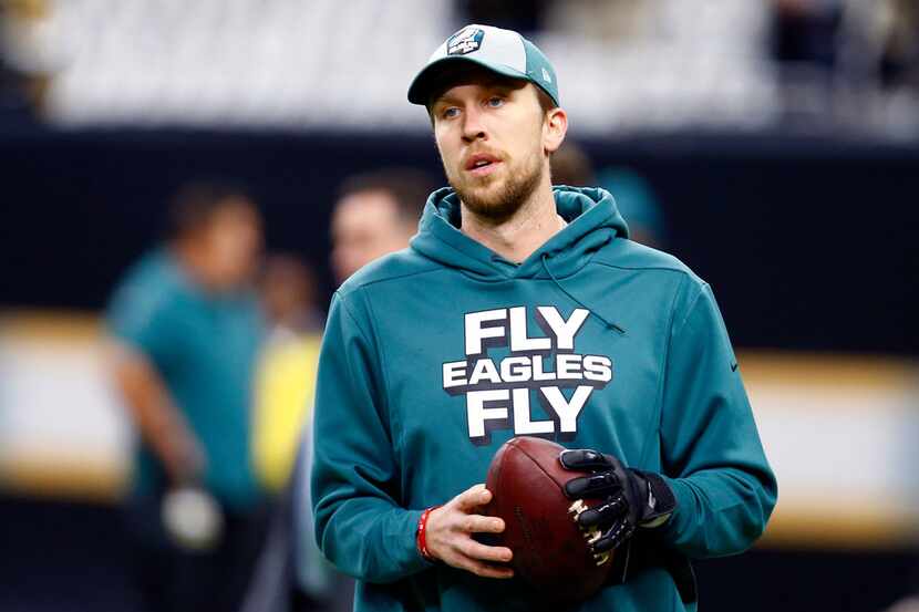 FILE - In this Jan. 13, 2019, file photo, Philadelphia Eagles quarterback Nick Foles warms...