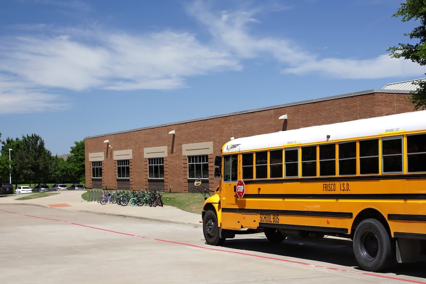 A bus parks for students at Isbell Elementary School in Frisco, TX, on Apr. 26, 2019.