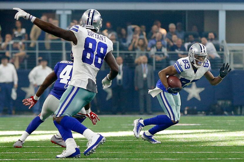 Dallas Cowboys wide receiver Dez Bryant (88) points for wide receiver Terrance Williams (83)...
