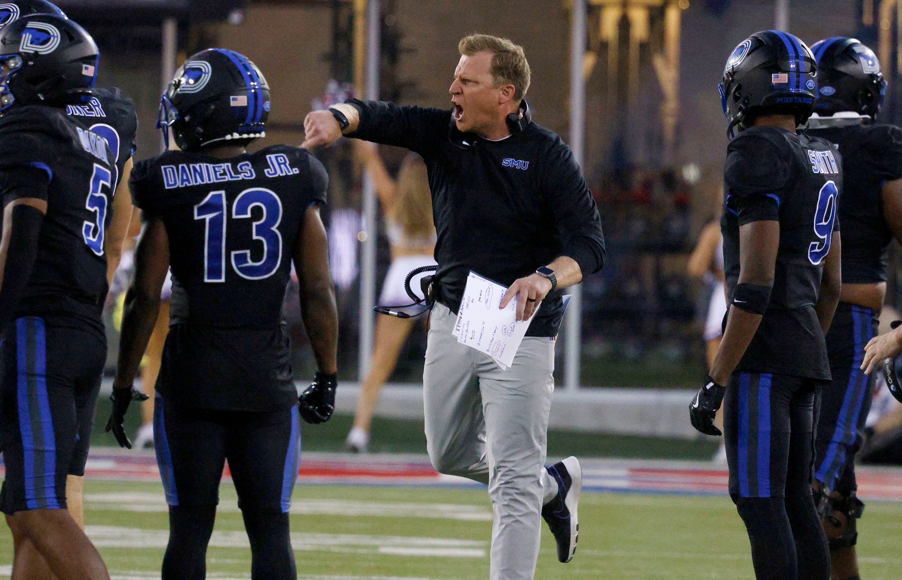 SMU head coach Rhett Lashlee talks to his players during the second half of an NCAA college...