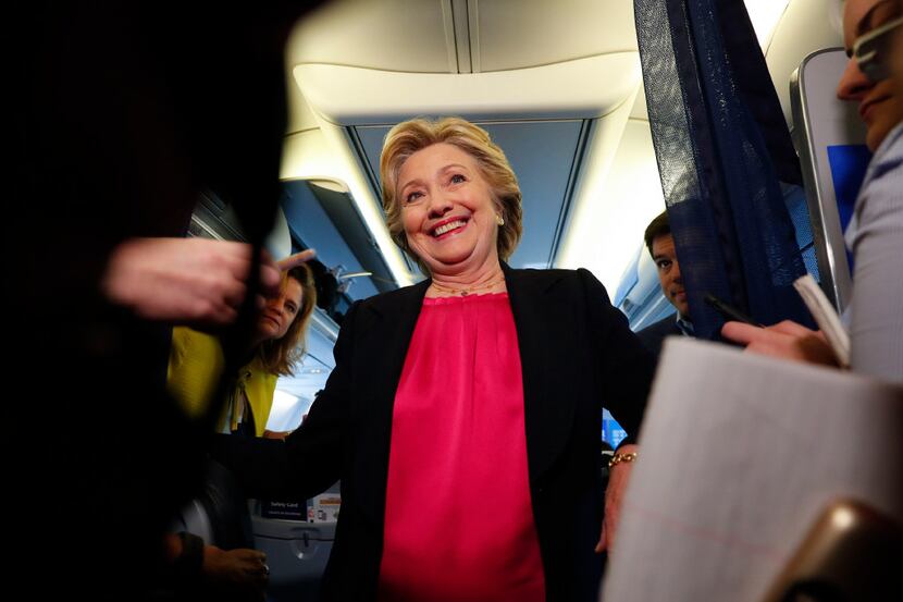 Hillary Clinton spoke with reporters aboard her campaign plane in White Plains, N.Y., en...