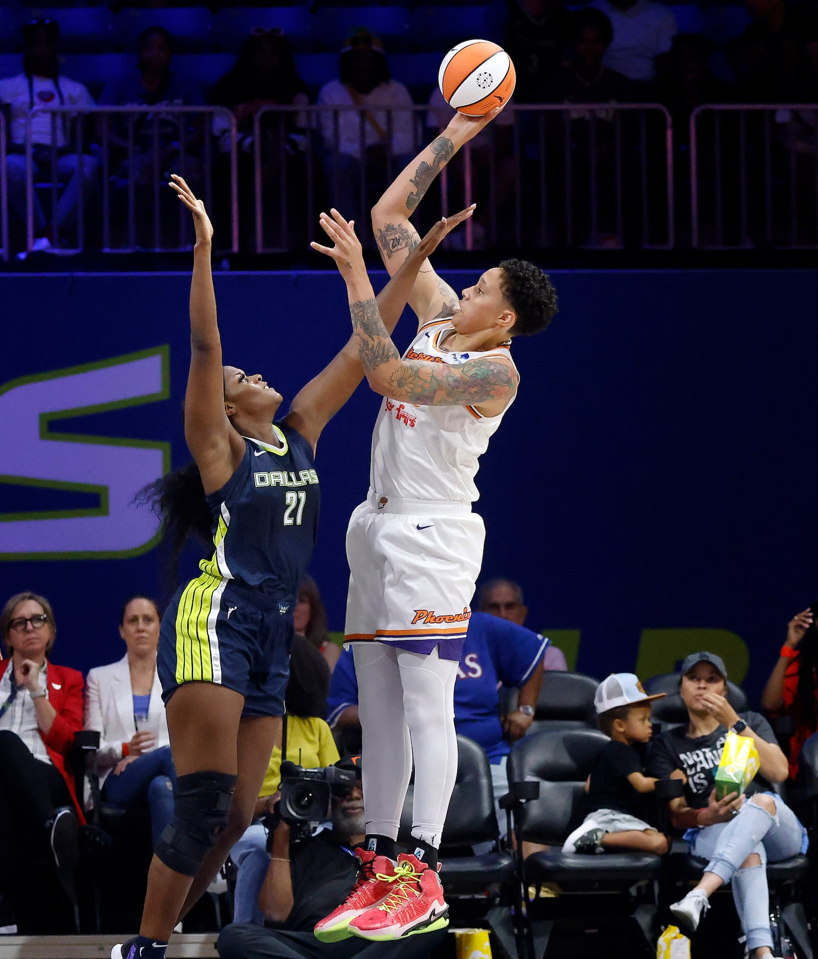 Phoenix Mercury center Brittney Griner (42) takes a shot over Dallas Wings center Kalani...