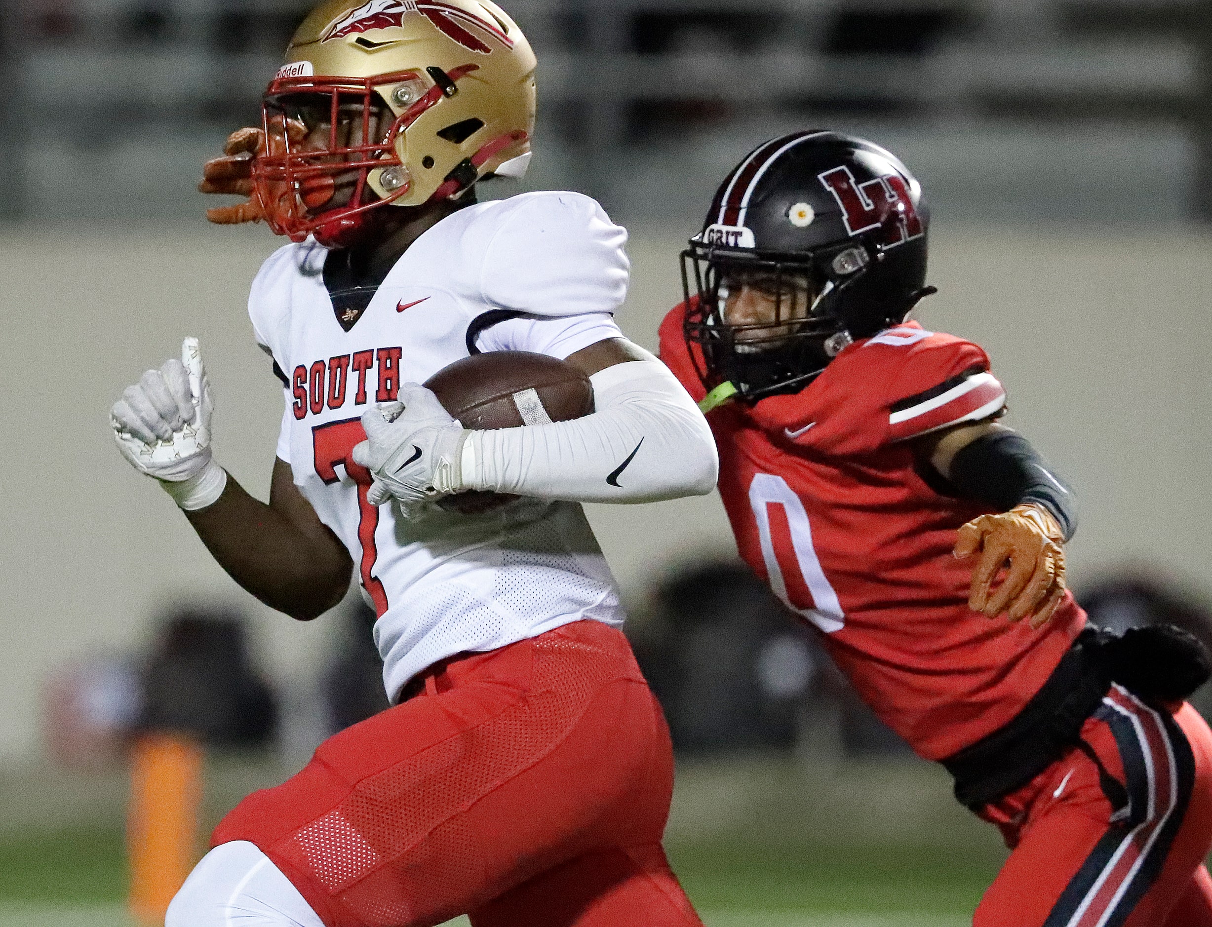 South Grand Prairie High School quarterback Ryan Goss (7) is caught from behind by Lake...