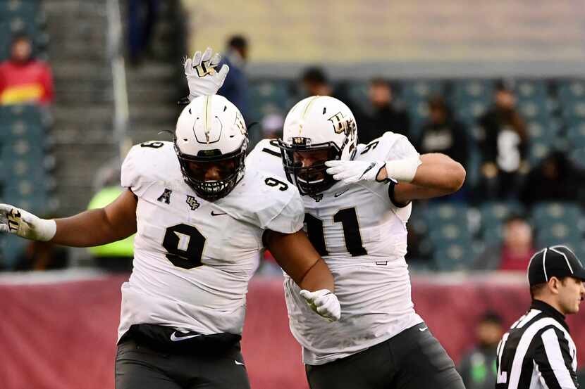 PHILADELPHIA, PA - NOVEMBER 18: Trysten Hill #9 of the UCF Knights and teammate Joey Connors...