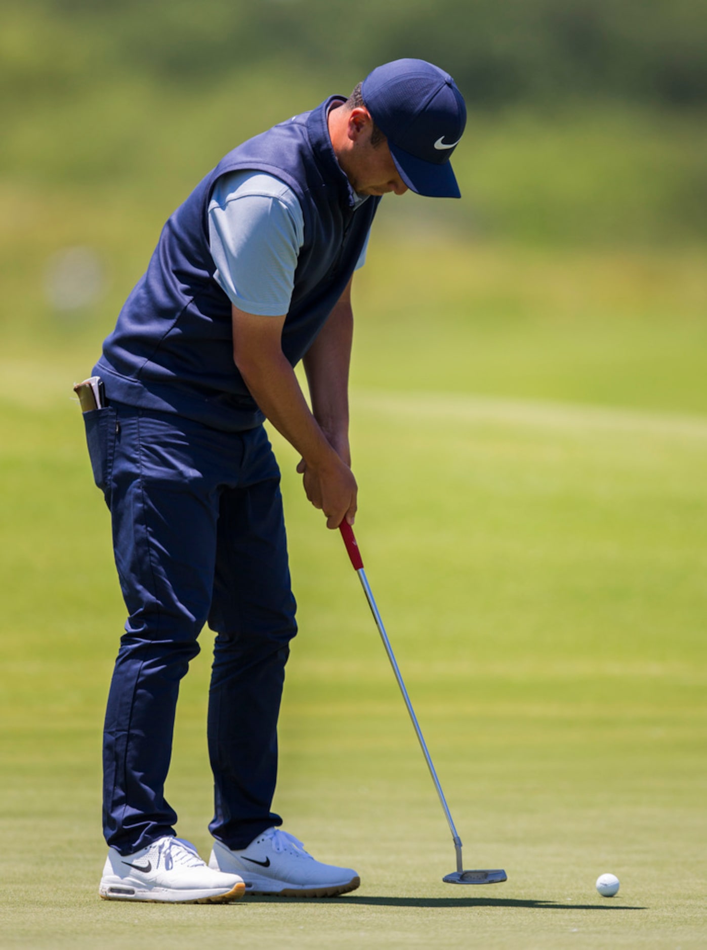 Doug Ghim putts on the third green during round 4 of the AT&T Byron Nelson golf tournament...