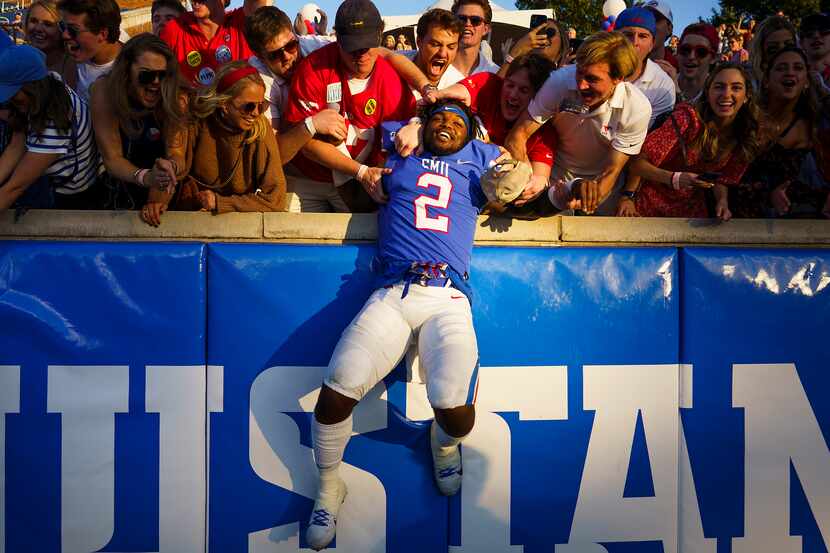 SMU running back Ke'Mon Freeman (2) celebrates with fans after a victory over Temple in an...