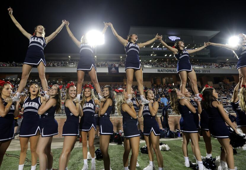 The Allen High School cheerleaders celebrate a win over Coppell High School at Eagle Stadium...