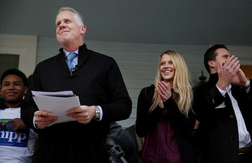 Longtime television reporter Brett Shipp, standing with his children, Katherine Shipp and...